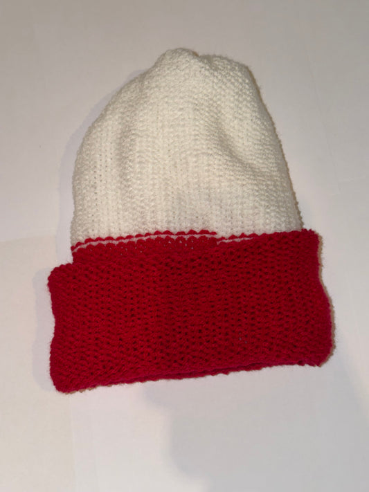 Festive Christmas Beanie in red and white colors, perfect handmade holiday accessory for winter warmth.