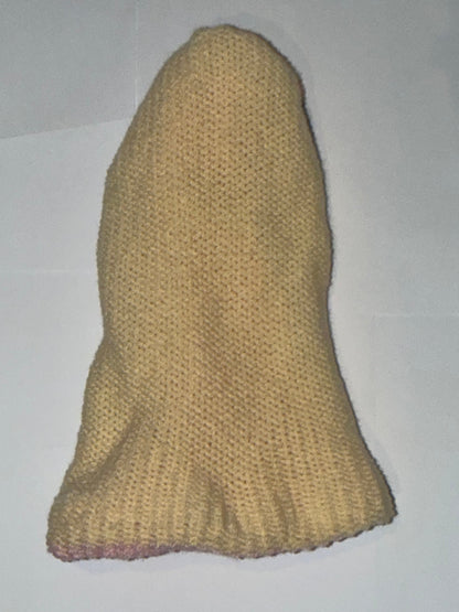 Handmade Reversible Wooly Beanie Light Pink and Cream on a plain background.